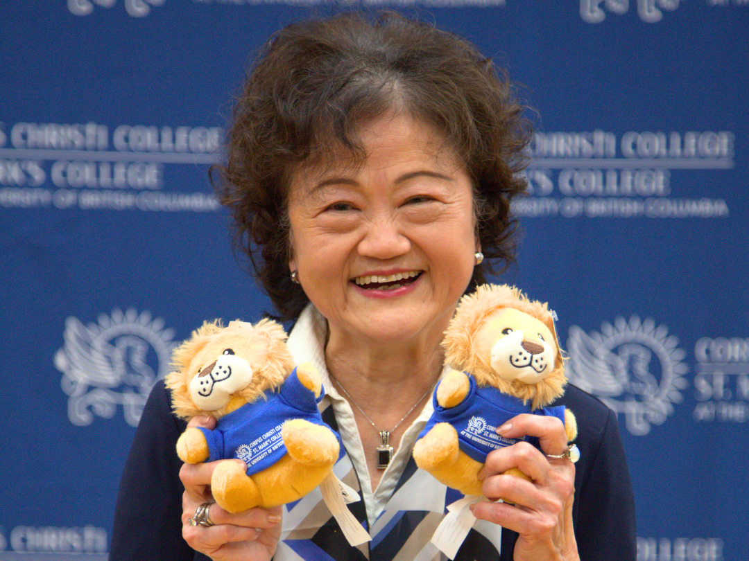 Jenny Cheng—whose gift funded the creation of the full-size mascot costume, supported a student honorarium for Marko’s appearances at events, and helped produce Marko stuffies—holds up two miniature versions of the new mascot at the 25th Annual Fundraising Breakfast.